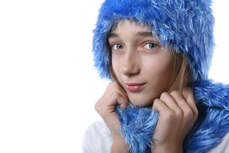 Blond teenage girl wrapped in a scarfの写真素材