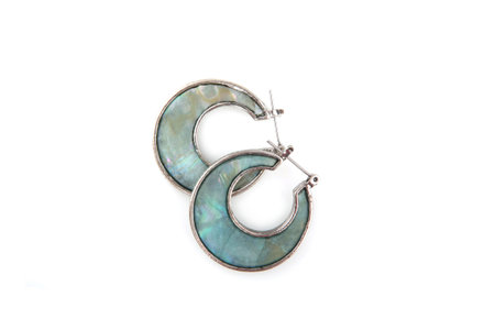 Green female earrings isolated on whiteの写真素材