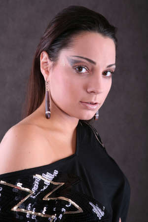Beautiful brunette posing with artistic makeupの写真素材