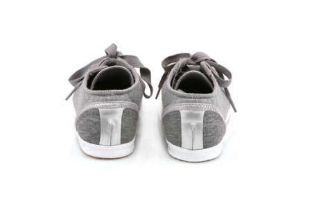 Female sneakers isolated on whiteの写真素材