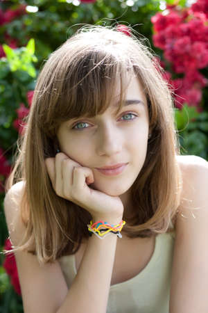 Portrait of a teenage girl in the flower gardenの写真素材