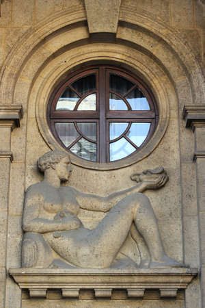 Building facade with relief of a woman in Zagreb, Croatiaの写真素材
