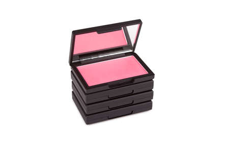 Pink blush on a pile of blush boxes isolated on whiteの写真素材