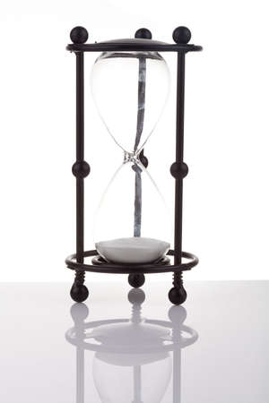 Hourglass on white background with reflectionの写真素材