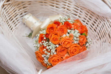 Wedding bouquet in wicker basketの写真素材