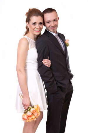 Young wedding couple isolated on whiteの写真素材