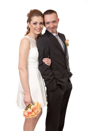 Young wedding couple isolated on whiteの写真素材