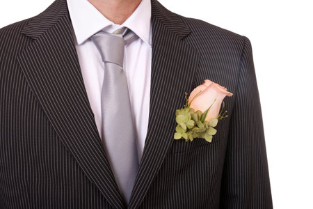 Detail of a groom's necktie and boutonniere