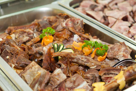Lamb meat in a heated trayの写真素材