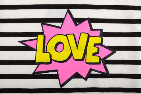 Detail of a 'Love' sign on a stripped fabricの写真素材