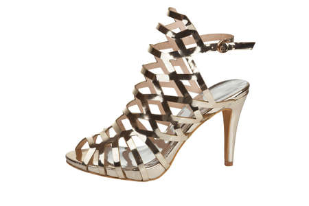 Stylish high heel sandal for spring and summer in golden mesh designの写真素材