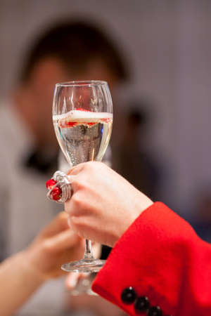 Sparkling wine in a woman's handの写真素材