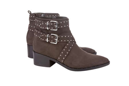 Brown studded ankle boots, isolated on white backgroundの写真素材
