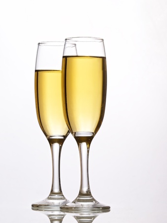 Two champagne glasses in toast の写真素材