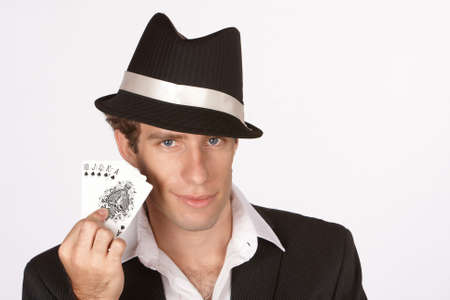 Poker player smirking with winning hand of royal flushのeditorial素材