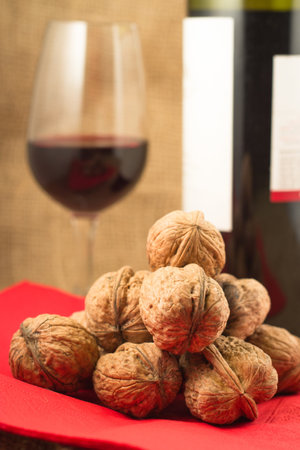 walnuts and red wine can be enjoyed in the winter eveningsの写真素材