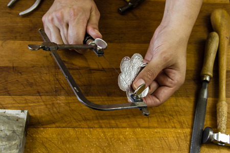 jewelry handmade by experienced goldsmiths with simple toolsの写真素材