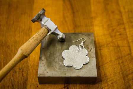 jewelry handmade by experienced goldsmiths with simple toolsの写真素材