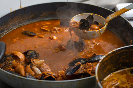 The fish soup is a fish soup made from shellfish, it is a typical dish of Tuscan cuisine.の写真素材