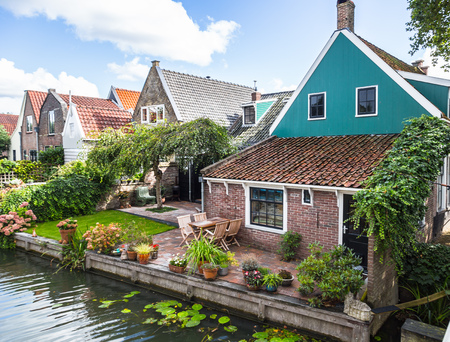 throughout the Netherlands you can find the characteristic houses on the canalsの写真素材