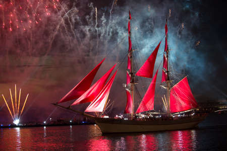 St. Petersburg, Russia - June 23 2014: The traditional annual output in the Neva sailfish with red sail in the day school leaversのeditorial素材