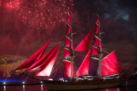 St. Petersburg, Russia - June 23 2014: The traditional annual output in the Neva sailfish with red sail in the day school leaversのeditorial素材