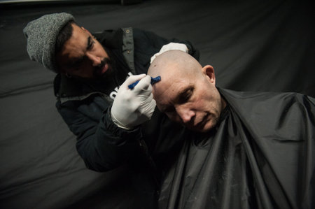 St. Petersburg, Russia - December 4, 2015: Australian barber Naser  Sabhani with friends have made...