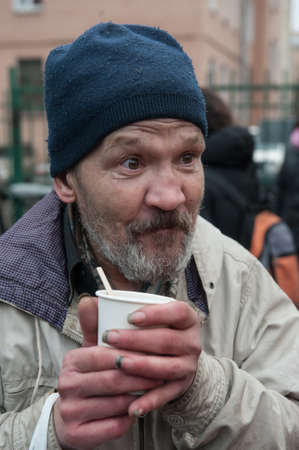 St. Petersburg, Russia - December 4, 2015: Australian barber Naser  Sabhani with friends have made hairstyles for homeless people on city streetのeditorial素材