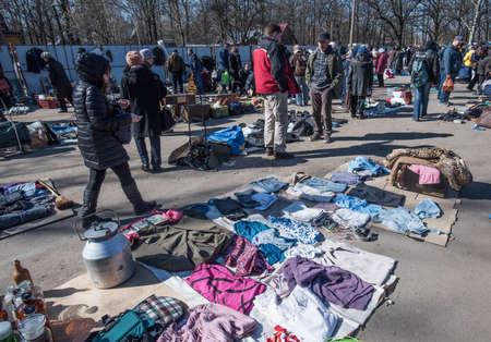 St. Petersburg, Russia - April 11, 2015: Flea market, Old clothes laid out on the ground for saleのeditorial素材