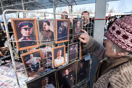 St. Petersburg, Russia - April 11, 2015: Flea market, The paintings with portraits of prominent figures of the Soviet era are exposed for saleのeditorial素材