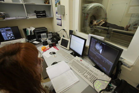 St. Petersburg, Russia - September 19, 2011: An employee of the medical staff monitor patients during computed axial tomography. Diagnosis of the human brainのeditorial素材