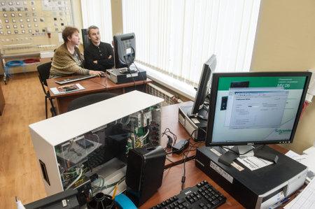 St. Petersburg, Russia - February 15, 2012: International Scientific and Educational Center of Schneider electric. Students learn in a classroom electrical equipment.のeditorial素材