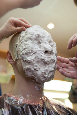 St. Petersburg, Russia - March 21, 2012: Creation of the cast face with a silicone mixture at the...