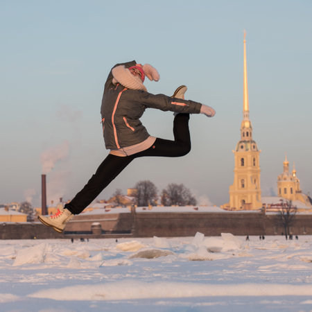 St.Petersburg, Russia - January 8, 2016: A girl is performing a dance movement - jump on the ice of...