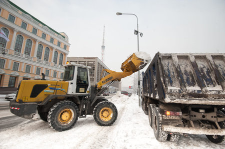 Saint-Petersburg, Russia - January 12, 2016: Snowplows working in the historic tourist center of the...