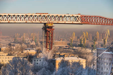 Saint-Petersburg, Russia - January 23, 2016: Construction of a bridge over the residential area of the city. Winter bright sunny day.のeditorial素材