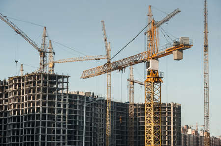 Saint-Petersburg, Russia - March 1, 2016: Construction of apartment houses of economy class. At the construction site work construction cranes.のeditorial素材