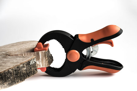 Durable plastic with a metal clamp ratchet closeup on a white background.の写真素材