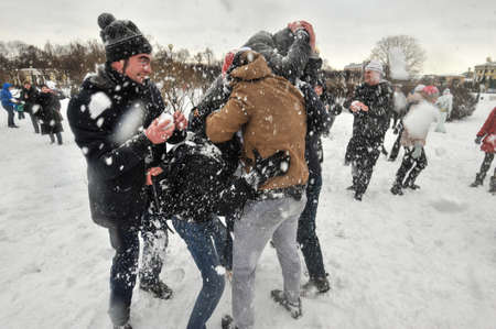 Saint-Petersburg, Russia - February 28, 2016: Flashmob "Snow battle" in the city center. Winter, snow, youth, good humor, passion.のeditorial素材