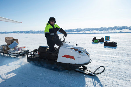 Chukotka, Russia - April 28, 2011: A member of the polar station in the North Arctic Ocean operates...