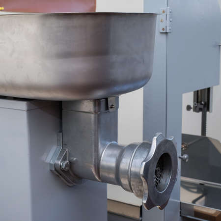 Big electric grinder for processing large quantities of meat in restaurants and small eateries. It processes more than 30 kilograms of meat per hour.の写真素材