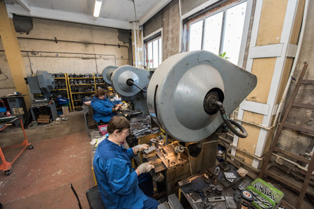 Saint-Petersburg, Russia - March 23, 2016: Women 50-55 years is working on drilling machines in the...