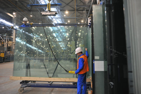 Saint-Petersburg, Russia - 4 February 2010: The float glass production plant. Working professionals...