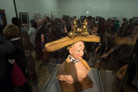 Saint-Petersburg, Russia - October 28, 2016: Exhibition of works by Salvador Dali in the State Hermitage. Spectator consider sculpture Retrospective Female Bustのeditorial素材