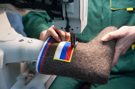 Gatchina Leningrad Region, Russia - December 15, 2014: The production line for the manufacture of Russian felt  boots with the national Russian state symbolsのeditorial素材