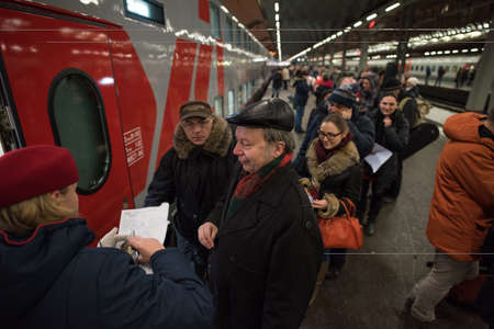 Saint-Petersburg, Russia - February 1, 2015: Conductor of the car to check the documents of...