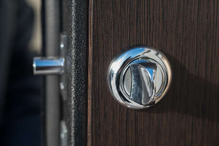 Metal apartment entrance door burglar sdelanaya by special technology. View of the door lock from the end of a close-up.の写真素材