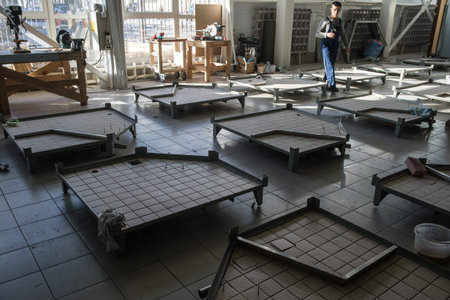 Saint-Petersburg, Russia - 14 February, 2014: the production of marine equipment factory "Geser". Workers assemble shower cabins shipのeditorial素材