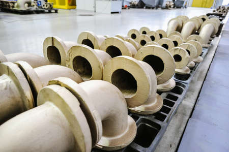 St. Petersburg, Russia - February 13, 2010: The Armalit factory produces ship armature for shipbuilding companies. Connecting pipes after machining on the production line.のeditorial素材