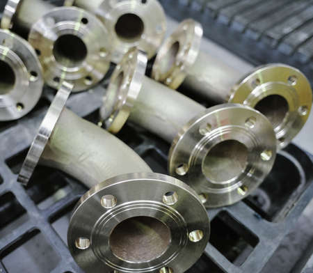 St. Petersburg, Russia - February 13, 2010: The Armalit factory produces ship armature for shipbuilding companies. Connecting pipes after machining on the production line.のeditorial素材